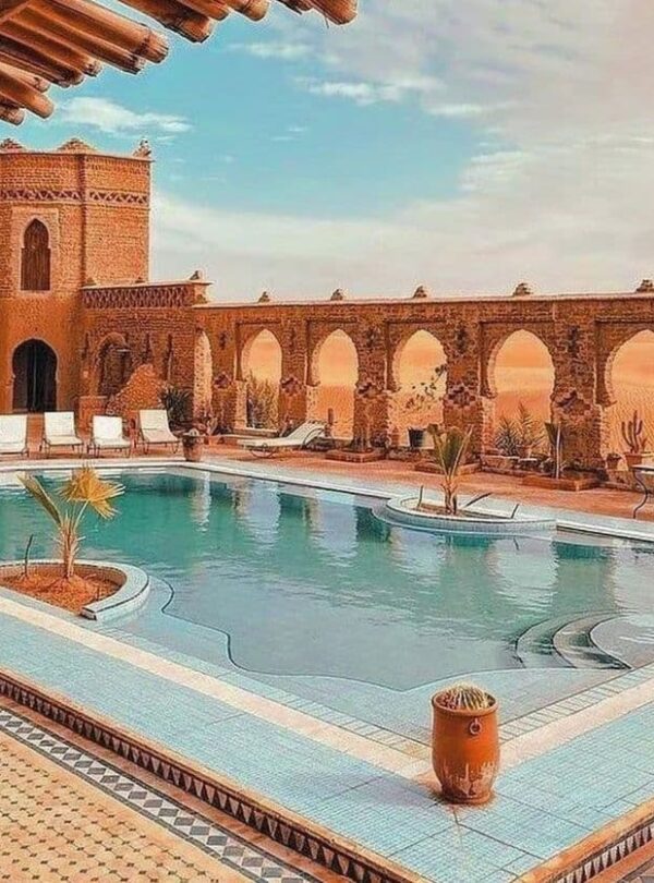 Luxury riad with swimming pool near Merzouga desert offering traditional Moroccan architecture and Sahara views