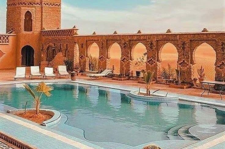 Luxury riad with swimming pool near Merzouga desert offering traditional Moroccan architecture and Sahara views