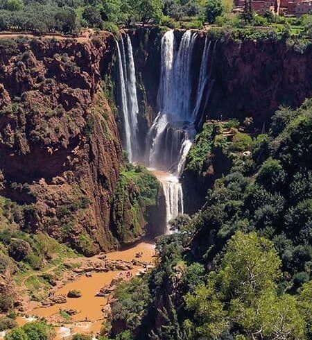 Ouzoud Waterfalls in the Atlas Mountains of Morocco, a popular full-day excursion from Marrakech surrounded by olive groves and red cliffs.