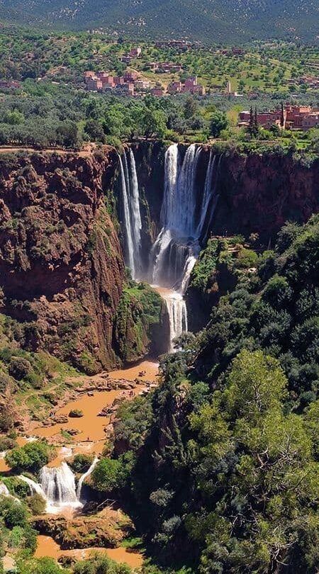 Ouzoud Waterfalls in the Atlas Mountains of Morocco, a popular full-day excursion from Marrakech surrounded by olive groves and red cliffs.