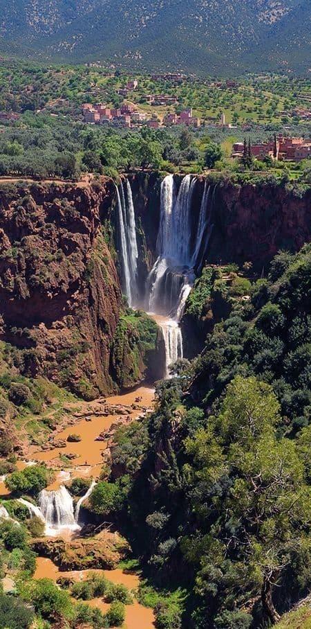 Ouzoud Waterfalls in the Atlas Mountains of Morocco, a popular full-day excursion from Marrakech surrounded by olive groves and red cliffs.
