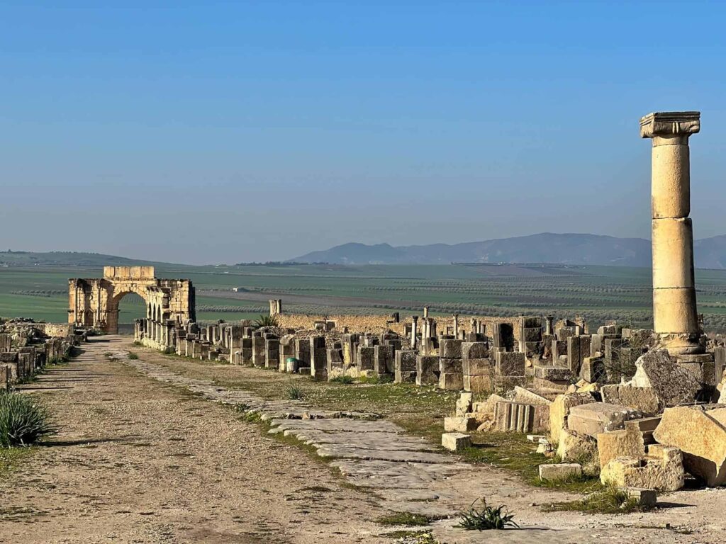 Ancient Roman ruins of Volubilis near Meknes, Morocco, a popular historical day trip from Fes.